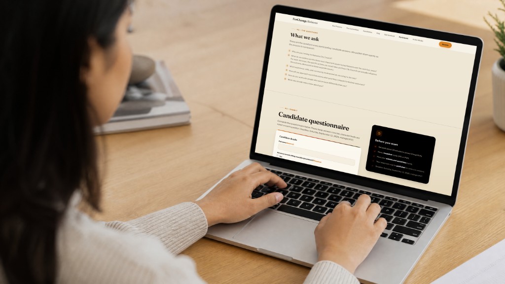 Laptop showing the ForChange Kelowna candidate questionnaire, with published questions and a submission form
